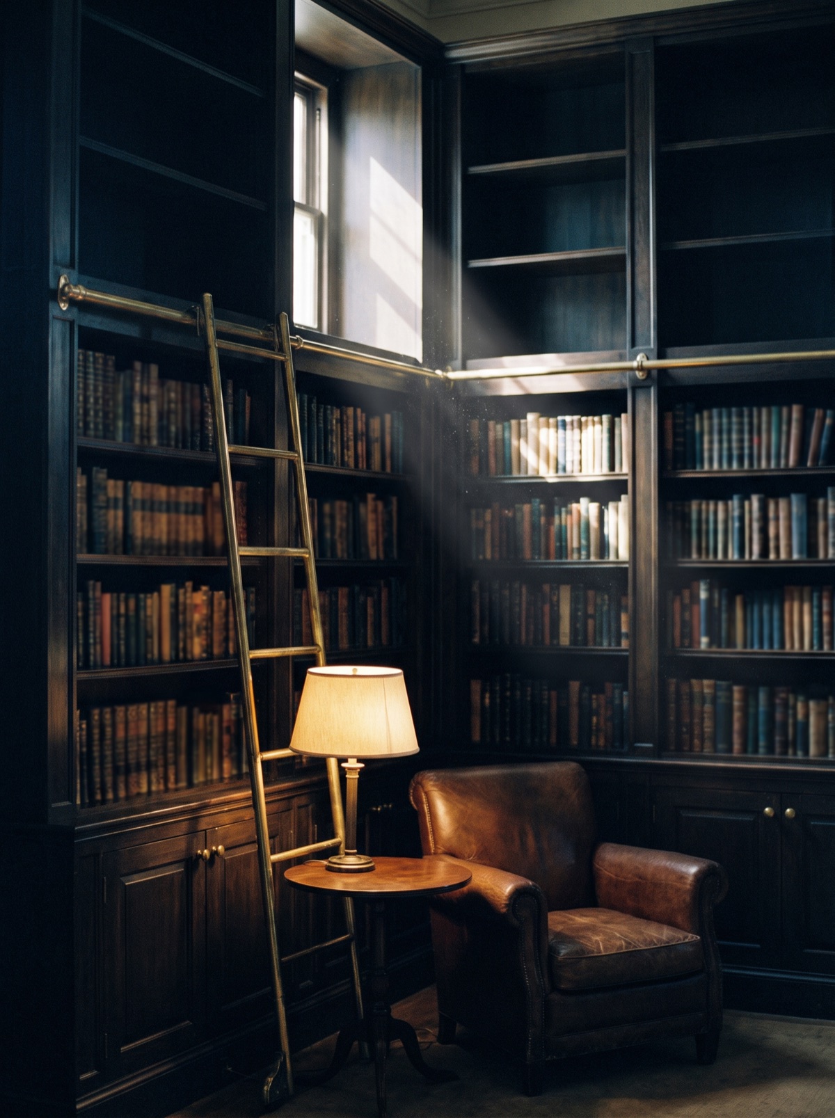 A private library with a leather armchair and warm reading lamp